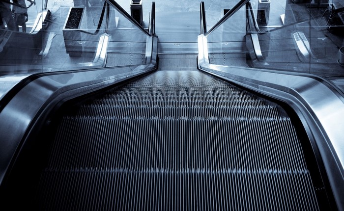 Escalator going down in a modern building
