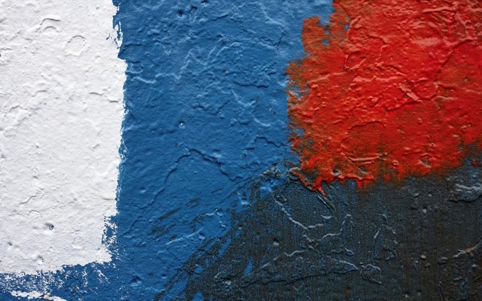 Abstract painting with white, blue, red, and black colors
