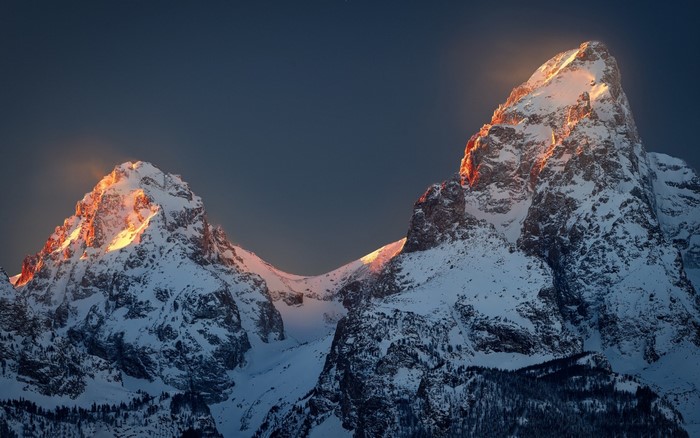 Snowy mountain peaks at sunset in Grand Teton National Park