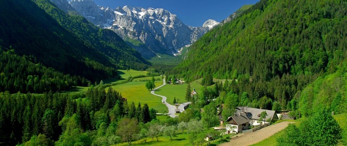 Green valley with mountains and a winding road
