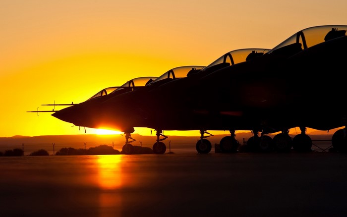 Fighter jets lined up at sunset