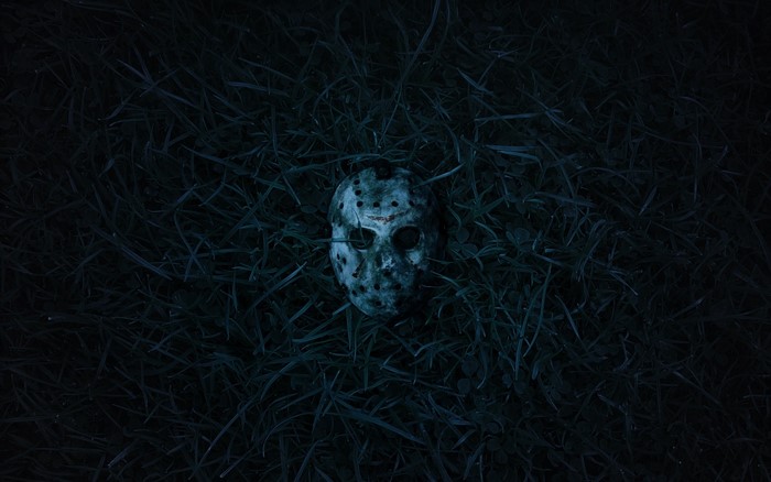 Jason Voorhees mask in grass