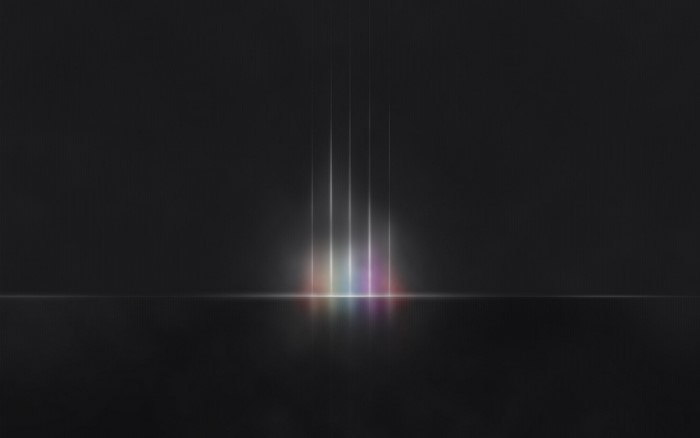 Abstract light streaks with rainbow colors on dark background