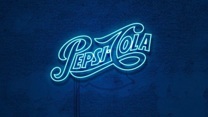 Pepsi-Cola neon sign on brick wall