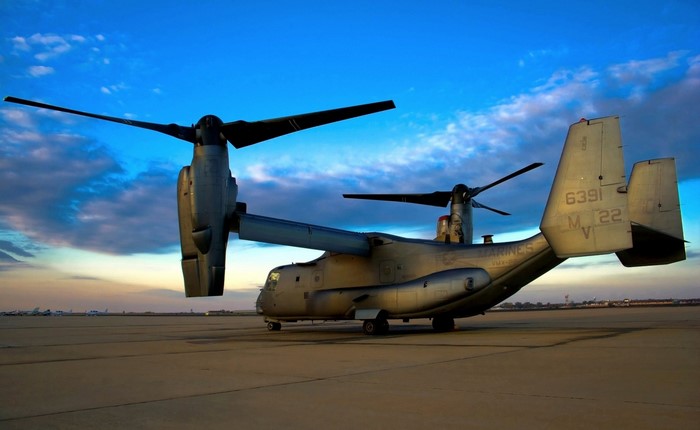 Bell Boeing V-22 Osprey on tarmac at sunset