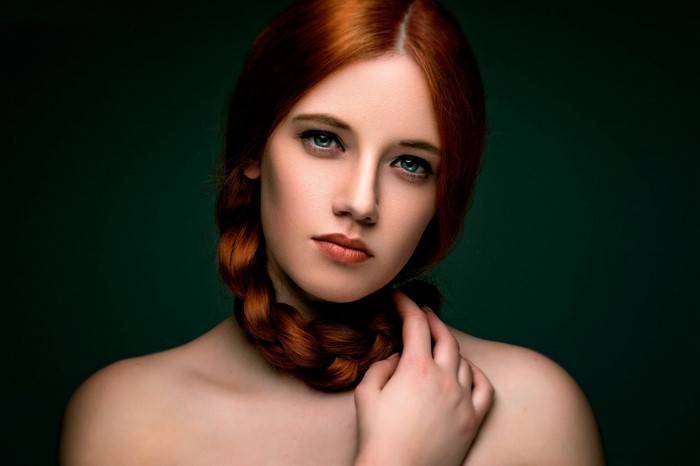 Portrait of a redhead woman with a braid