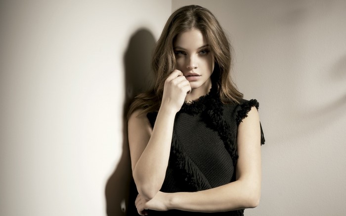 Barbara Palvin posing in a black dress