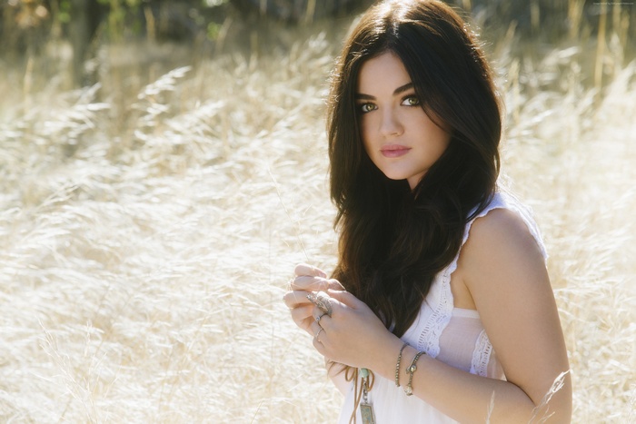 Lucy Hale in a white dress outdoors