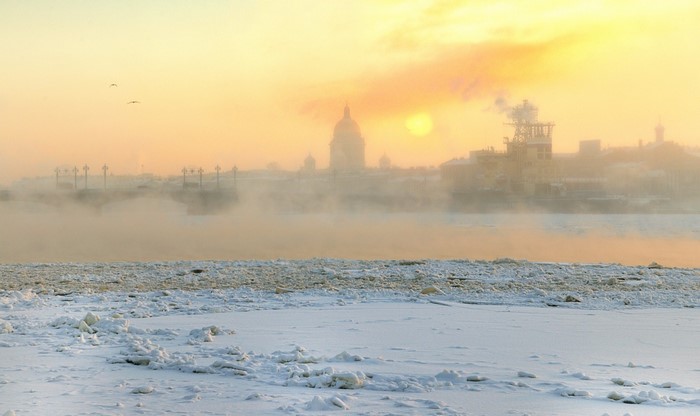 Winter sunrise over St. Petersburg with fog and ice