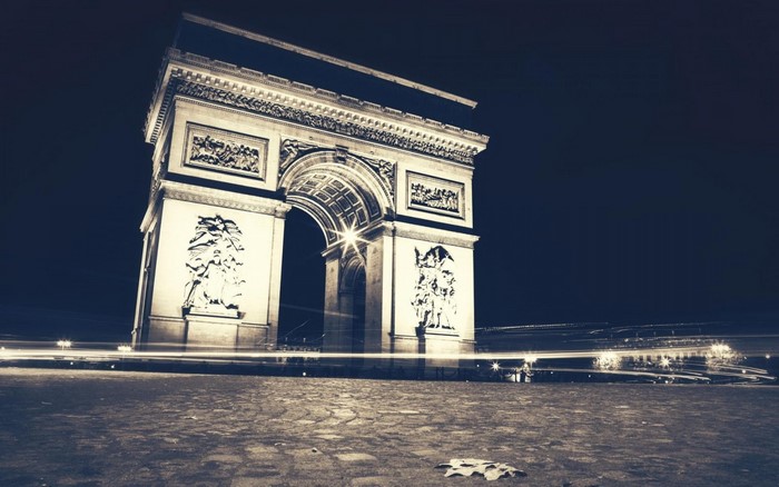 Arc de Triomphe at night with light trails