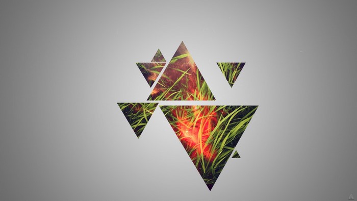Geometric triangles overlaying grass and fire