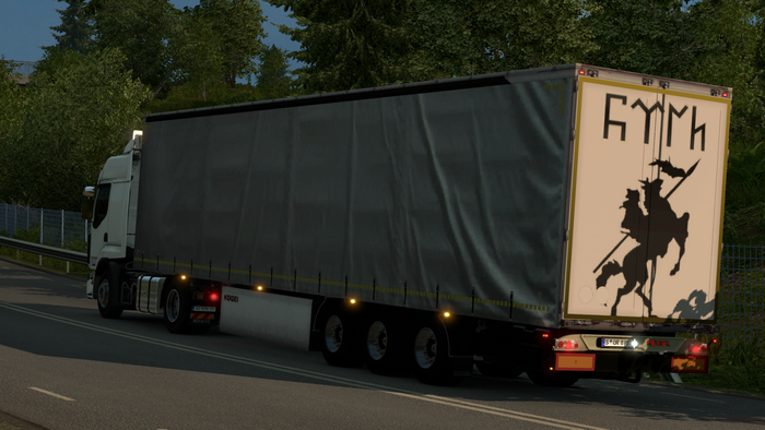 Truck with a trailer on a road