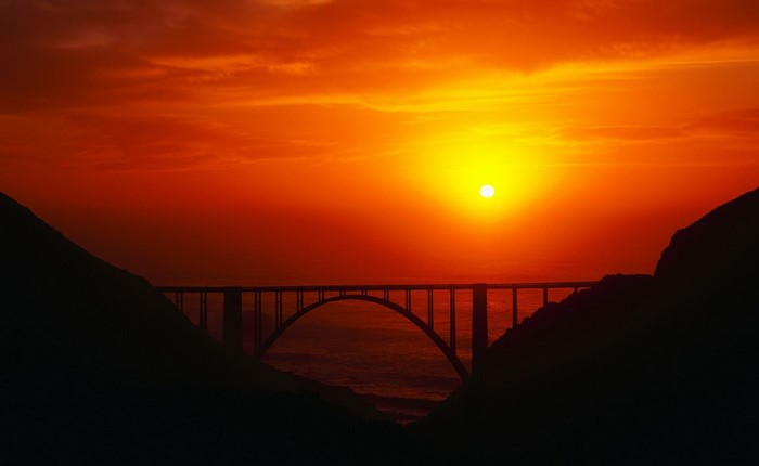 Bridge over the ocean at sunset