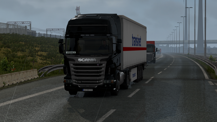 Scania R 730 truck with Trans.net trailer on highway