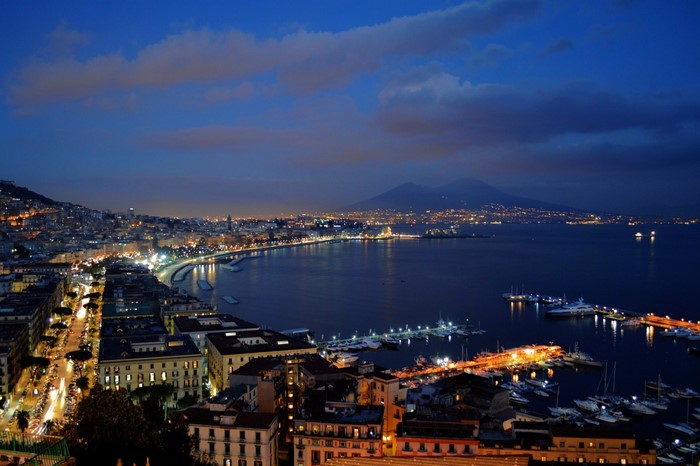 Napoli cityscape at dusk with Mount Vesuvius in the background