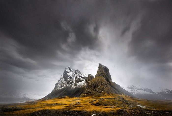Dramatic mountain landscape under dark clouds in Iceland