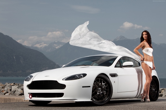 Woman in bikini and white Aston Martin V8 Vantage