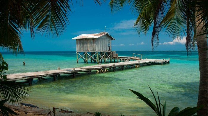 Wooden stilt house on a pier in the Caribbean Sea