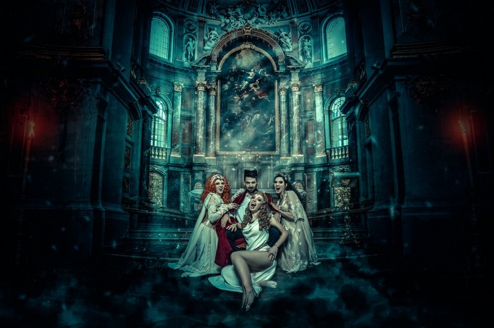 Vampires in a dark, ornate church