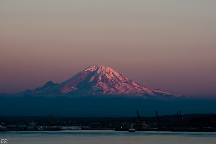 Mount Rainier at sunset over a harbor