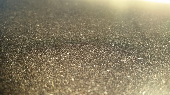 Close-up of textured surface with sunlight