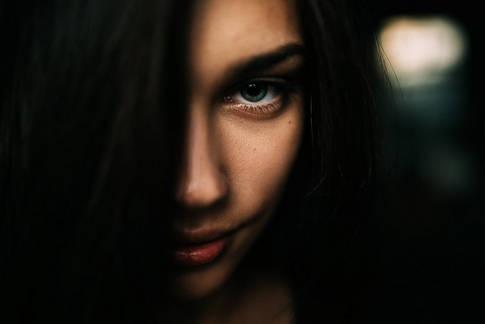 Close-up portrait of a woman with dark hair