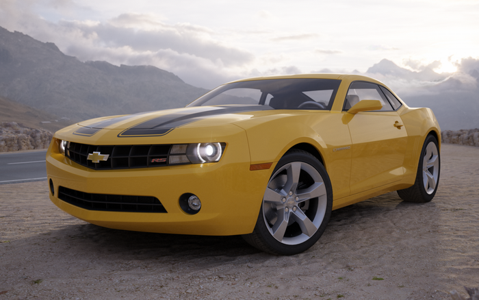 Yellow Chevrolet Camaro RS parked on a dirt road