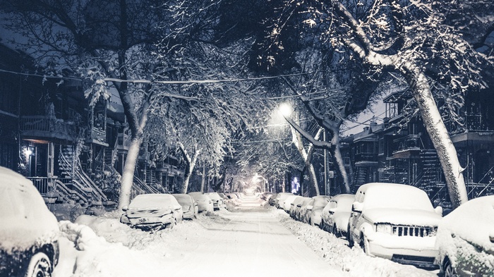 Snow covered street in New York at night
