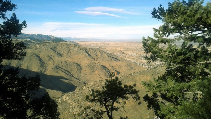 View of foothills and plains from a mountain trail