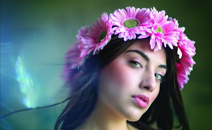 Woman wearing a pink flower crown close up