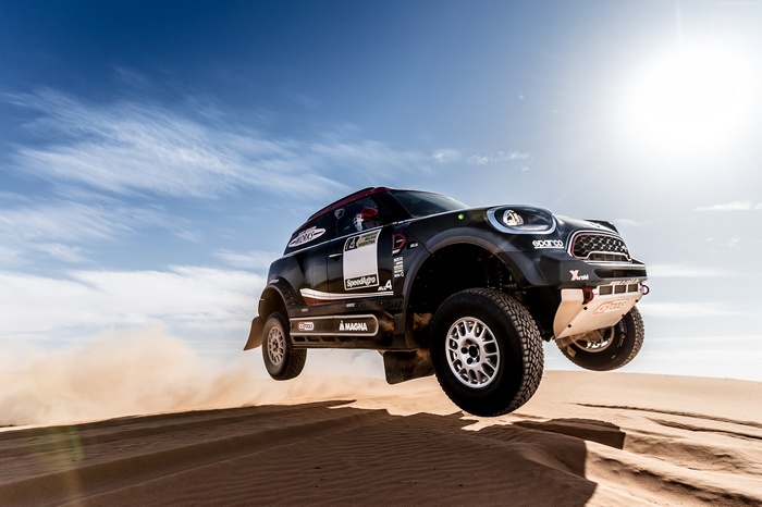 Mini Rally Car Jumps Over Sand Dune