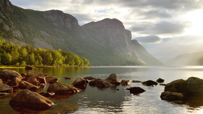Lake with mountains and rocks in Norway