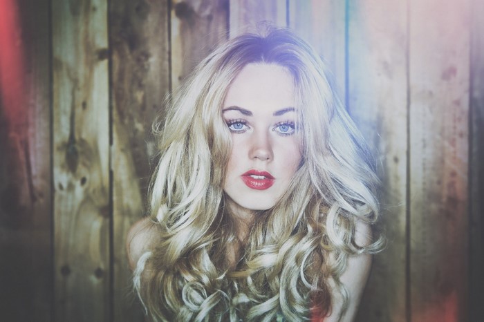 Woman with long blonde hair and red lipstick