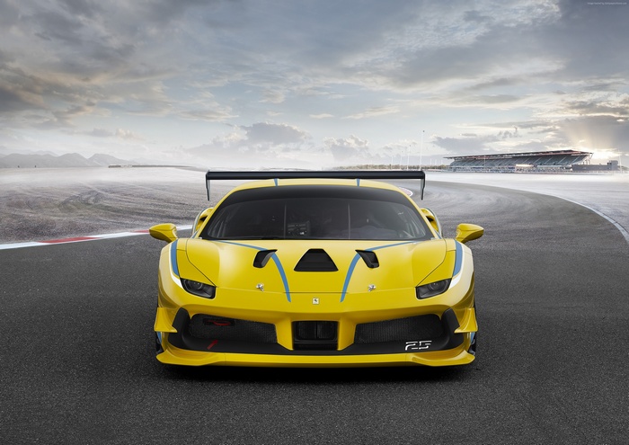 Yellow Ferrari 488 Challenge race car on track