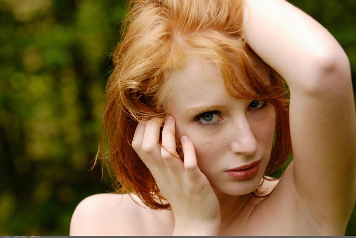 Portrait of a Redhead Woman with Intense Gaze