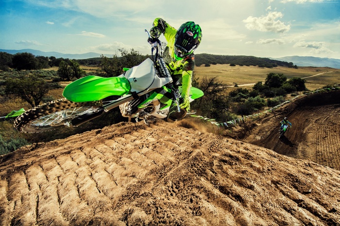Motocross rider on Kawasaki KX450F jumping