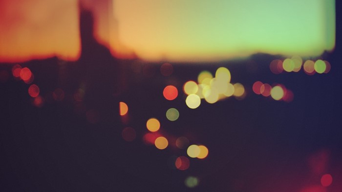 Bokeh lights at sunset with colorful sky