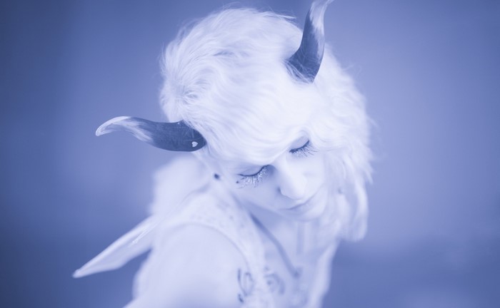 Woman with white hair and horns, fantasy art