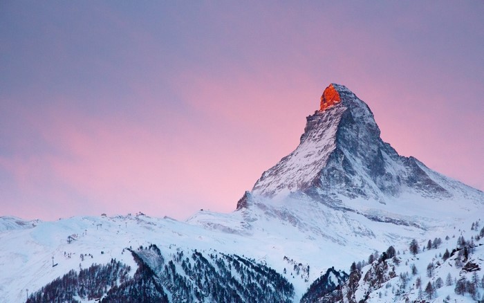 The Matterhorn mountain at sunrise with pink sky