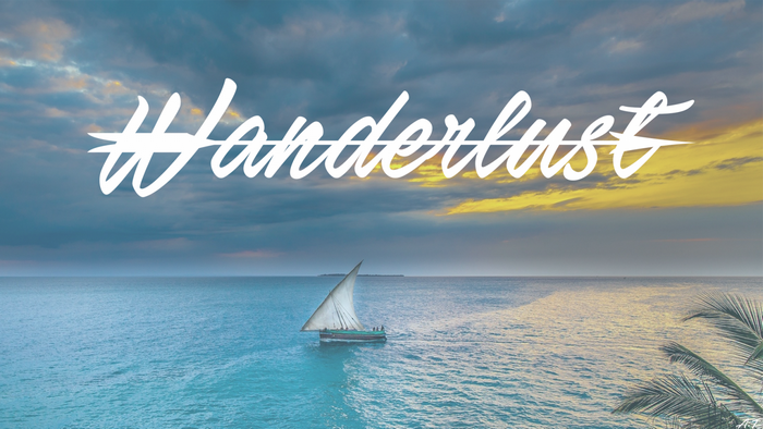 Sailboat on the ocean at sunset with #Wanderlust text