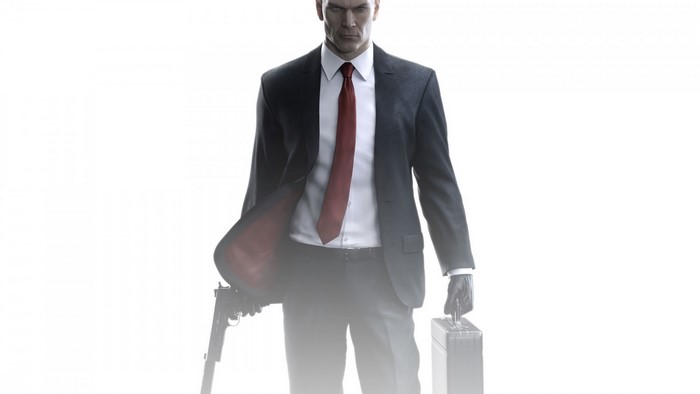 Agent 47 from Hitman holding a pistol and briefcase