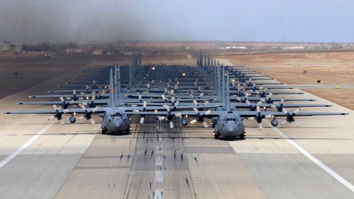 Lockheed C-130 Hercules aircraft lined up on a runway