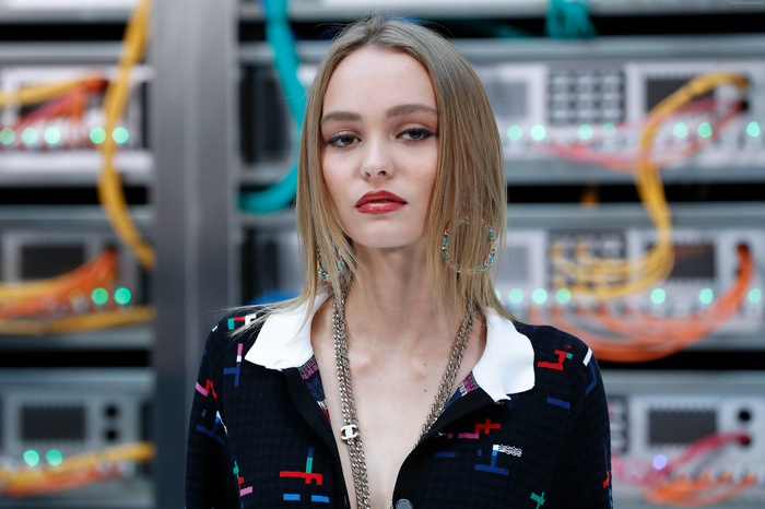 Lily-Rose Depp in front of server racks