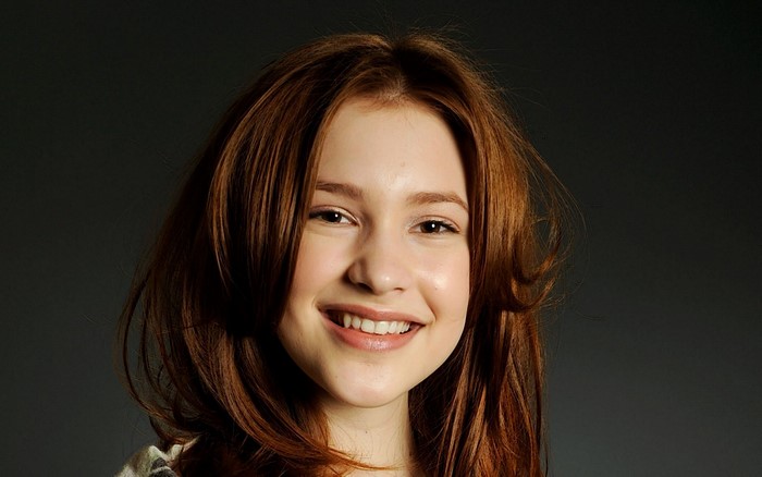 Alexia Fast smiling portrait