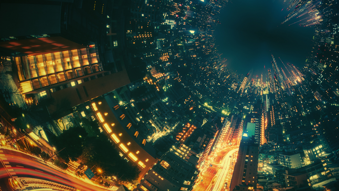 Night cityscape with light trails and illuminated buildings