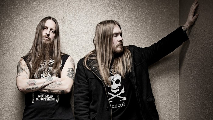 Two men from Darkthrone in a studio photograph