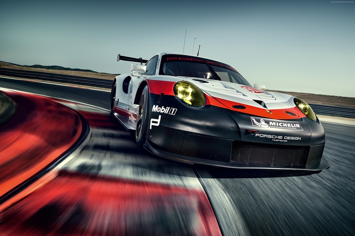 Porsche 911 RSR racing on a track