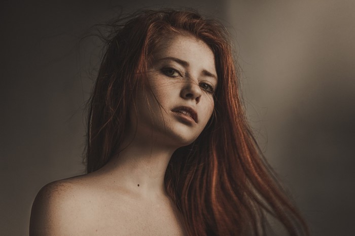 Portrait of a young woman with red hair
