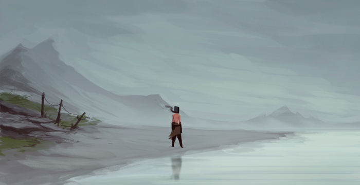 Person on a beach with mountains in the background