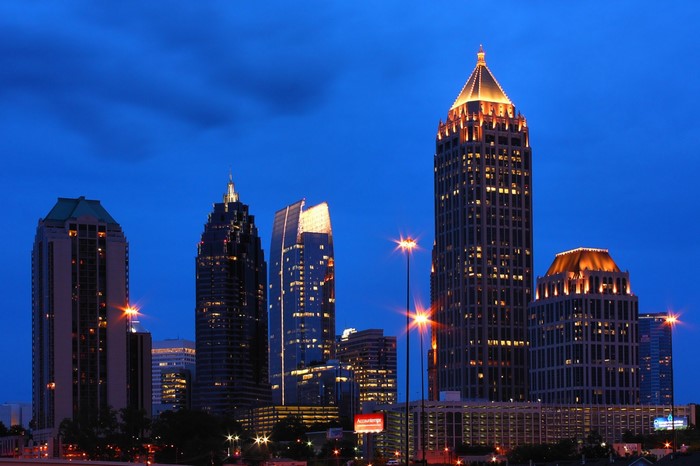 Atlanta skyline at dusk with illuminated skyscrapers